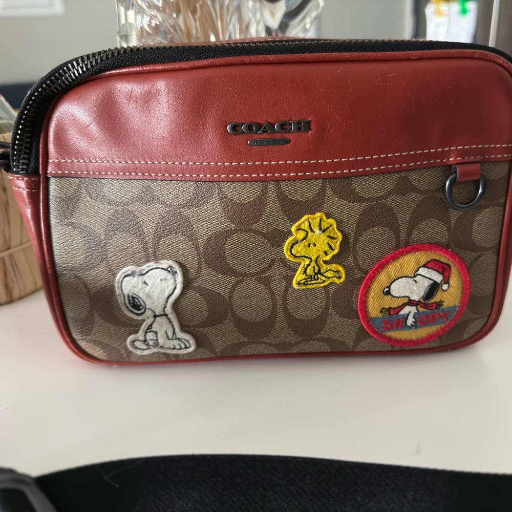 Authentic COACH Peanuts x cross body bag 
FREE SHIPPING by Purolator